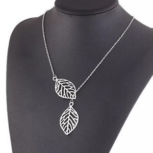 Delicate Silver Leaf Necklace. Comes with a teal polishing cloth.